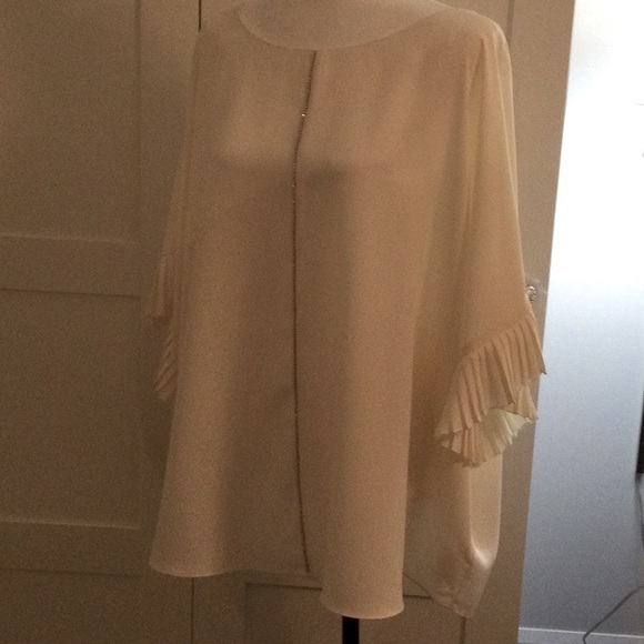 Net. White blouse with sparkle and pleated sleeves - Picture 1 of 6
